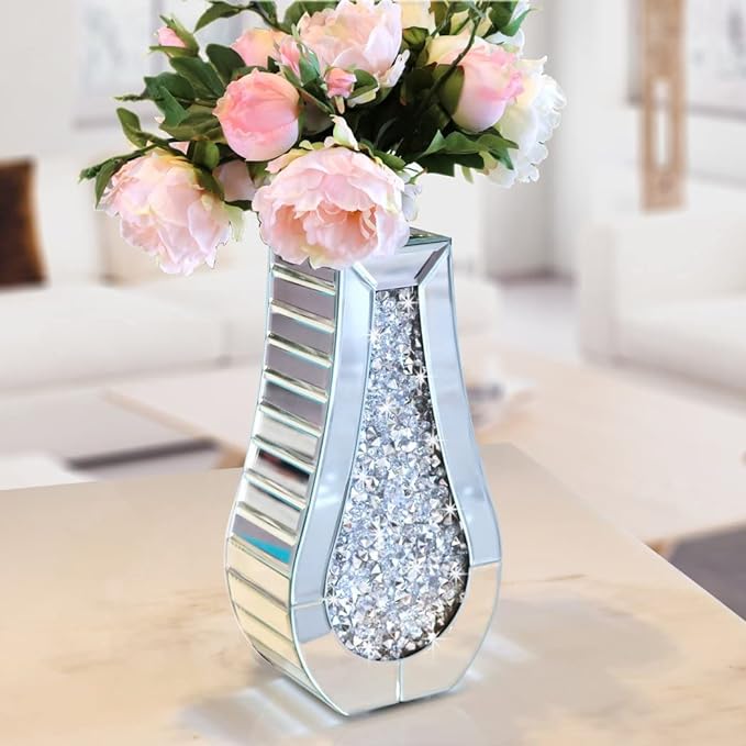 This vase is absolutely gorgeous and large. Well made and worth every penny. I made this arrangement for my dining room table. I love it!Second photo is redone to better fit table. Either way the vase is beautiful!