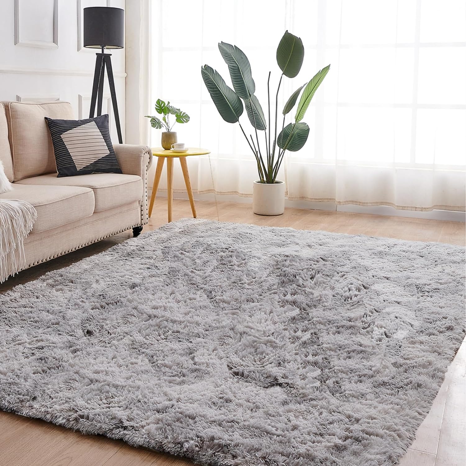 this rug is extremely soft, much more than i expected. it is super easy to clean . i used it for my bedroom and this looks so much classy and quality is extremely good. The price is also extremely reasonable compared to its quality i love this addition to my bedroom