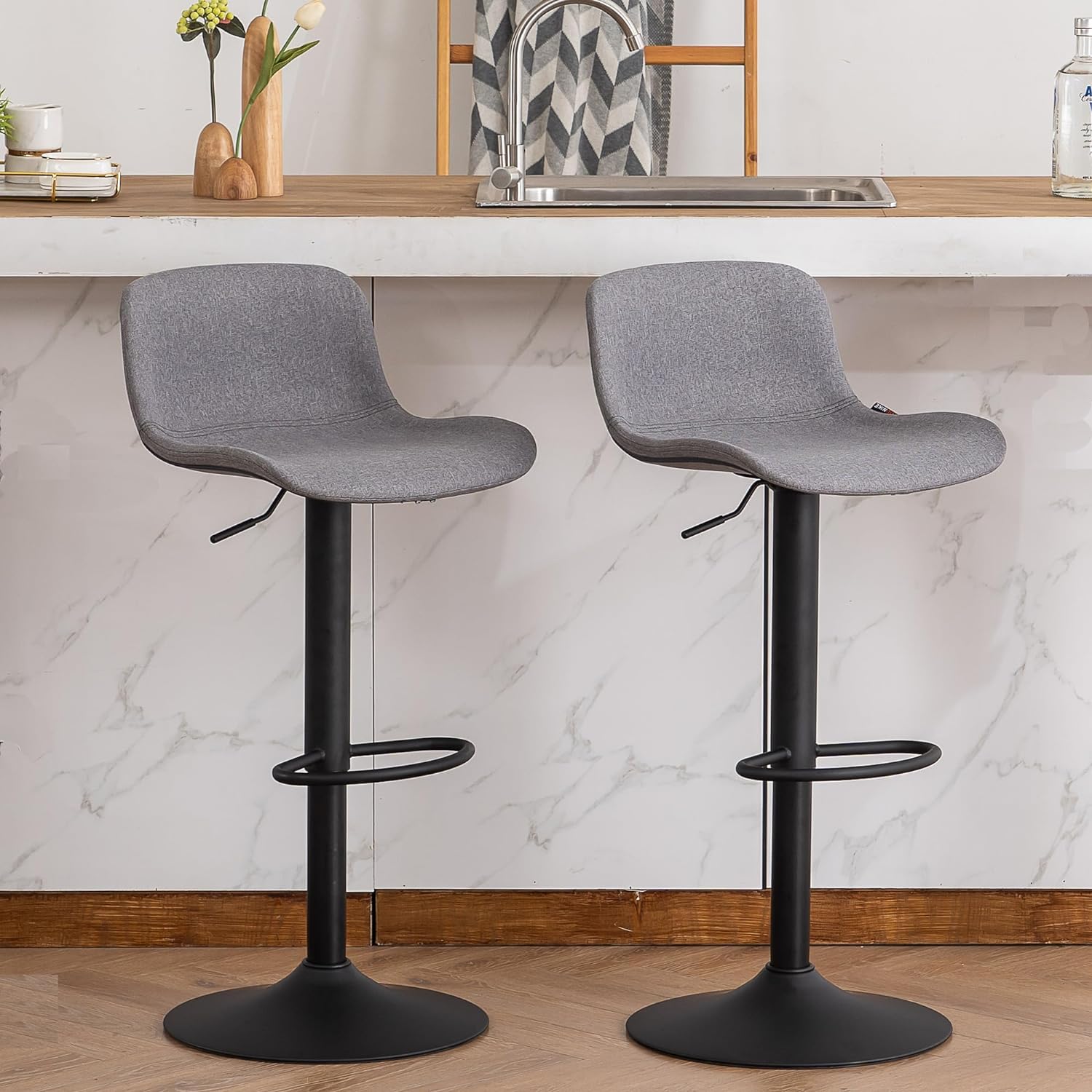 Very surprised at the sturdiness of these bar stools. My husband is 62 and I was worried about them being sturdy enough for him. We have been using them for several weeks and we really like them! Our last bar stools were too heavy and had protruding legs that we were always kicking. They were hard to pull out and took up too much space.I love the smaller foot print of the base, but still big enough for support. The swivel makes them more user friendly, and the height can be adjusted for a perf