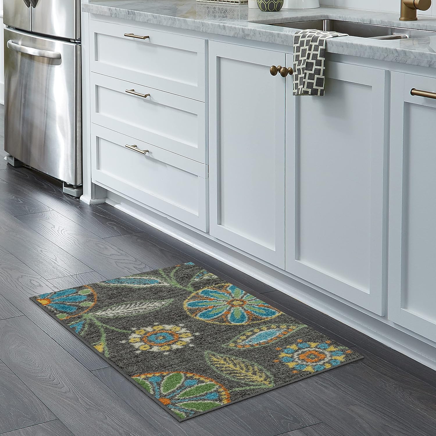 This rug is absolutely perfect. The size was just right for the area in my laundry room. It is a nice thickness and weight stays in place great. Love the color and it doesn't show dirty from peoples shoes coming in from outside.